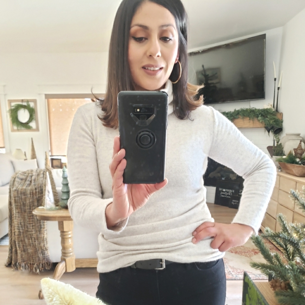 Beige long sleeve turtle neck.
